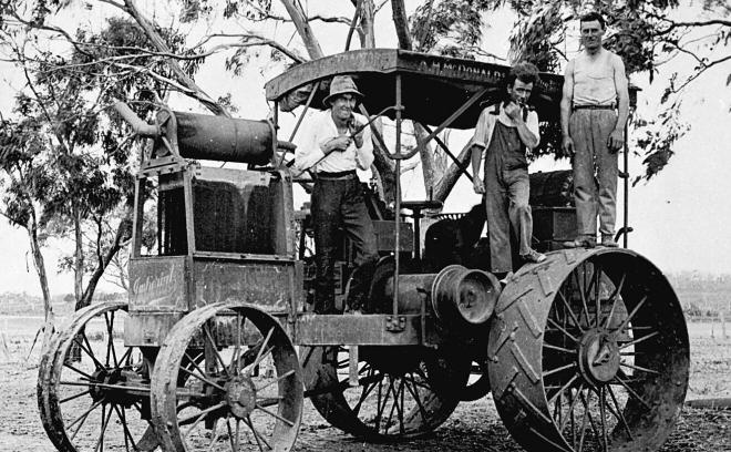 Three men with the ‘EB’ tractor at French Island, 1926